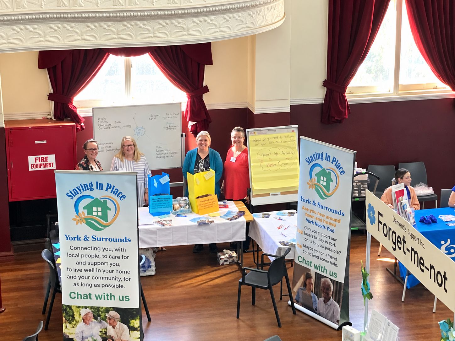 Staying in Place volunteers at their information stall at a community event
